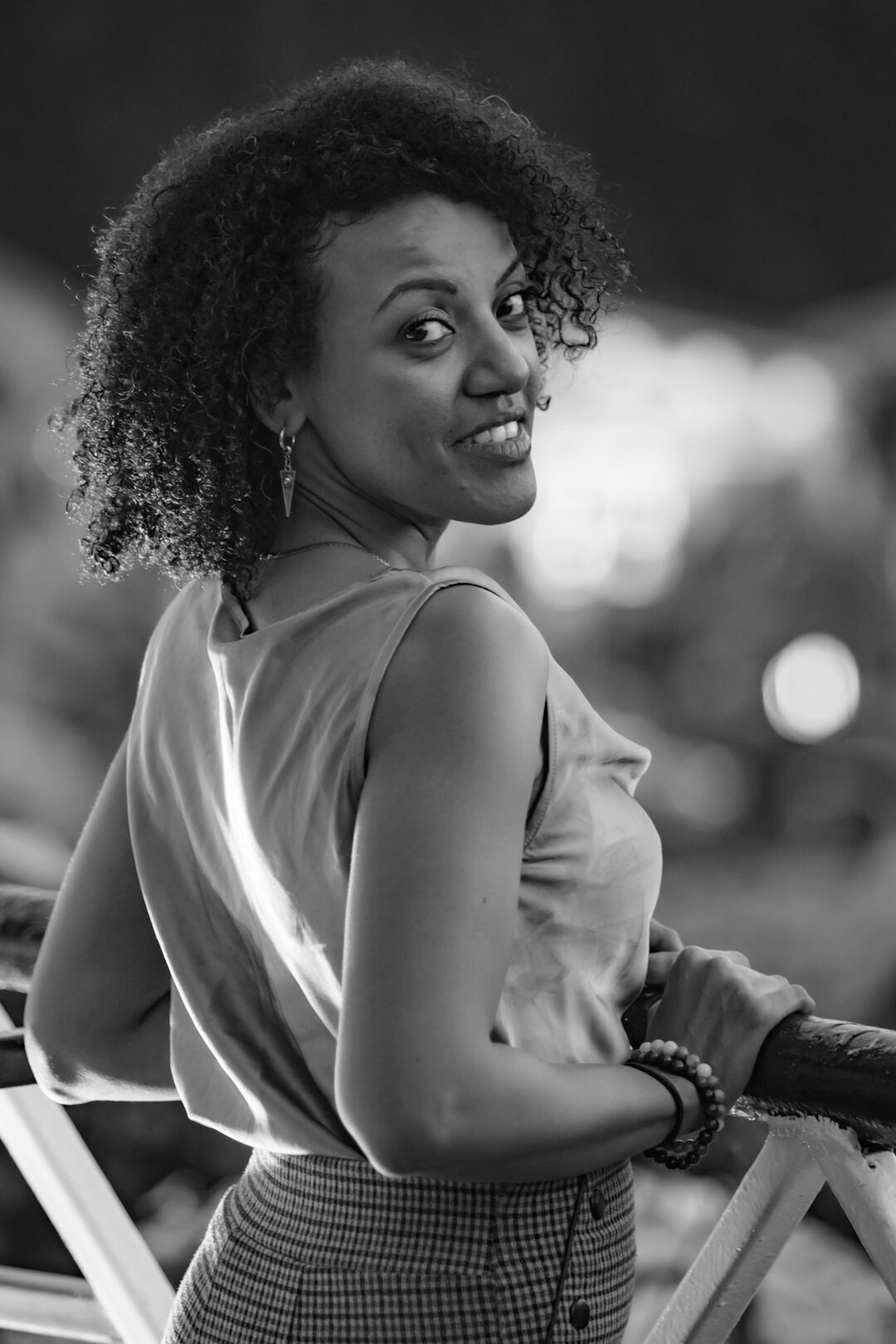Portrait of a professional woman with curly hair smiling